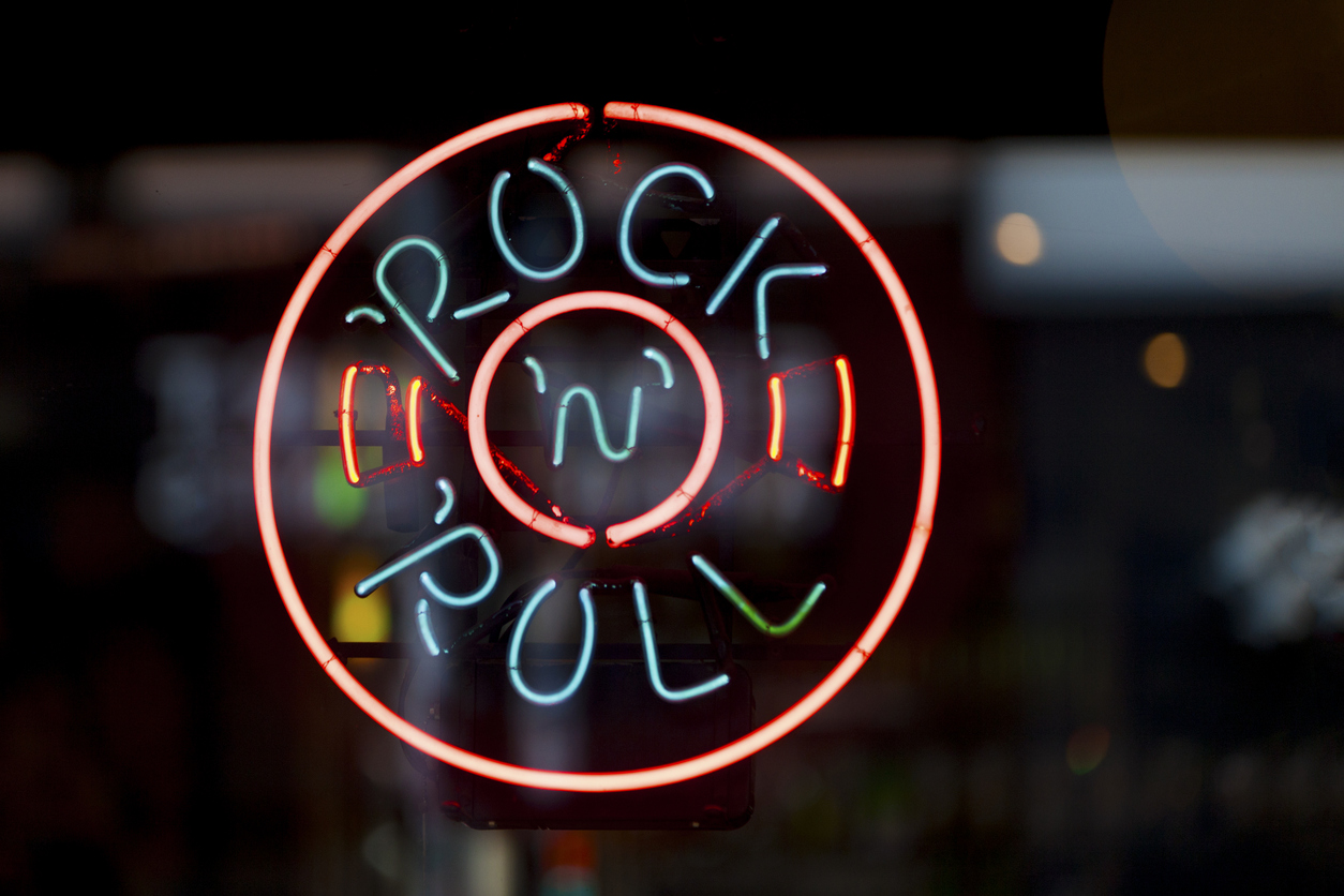 Close-up on a neon light shaped into a circle with written inside 