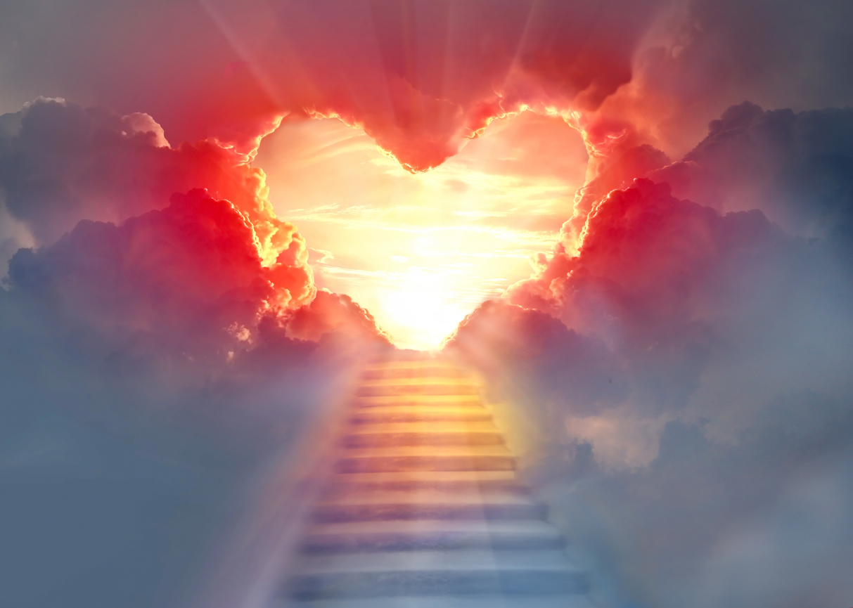 Stairway leading to heavenly clouds with a heart in the middle